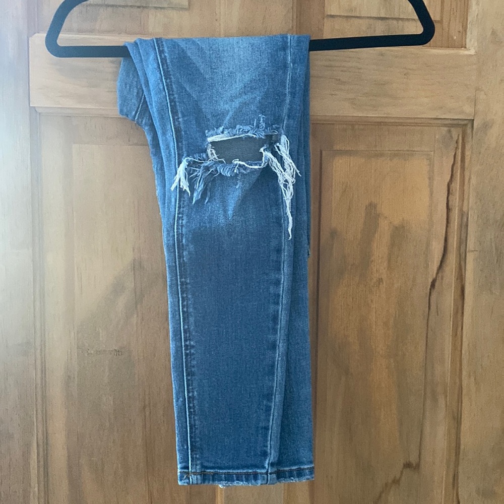 Tight blue skinny jeans with rips